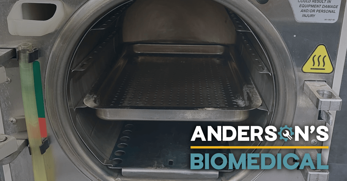 Open sterilizer chamber showing trays and internal components, emphasizing the importance of maintenance and repair for optimal performance.
